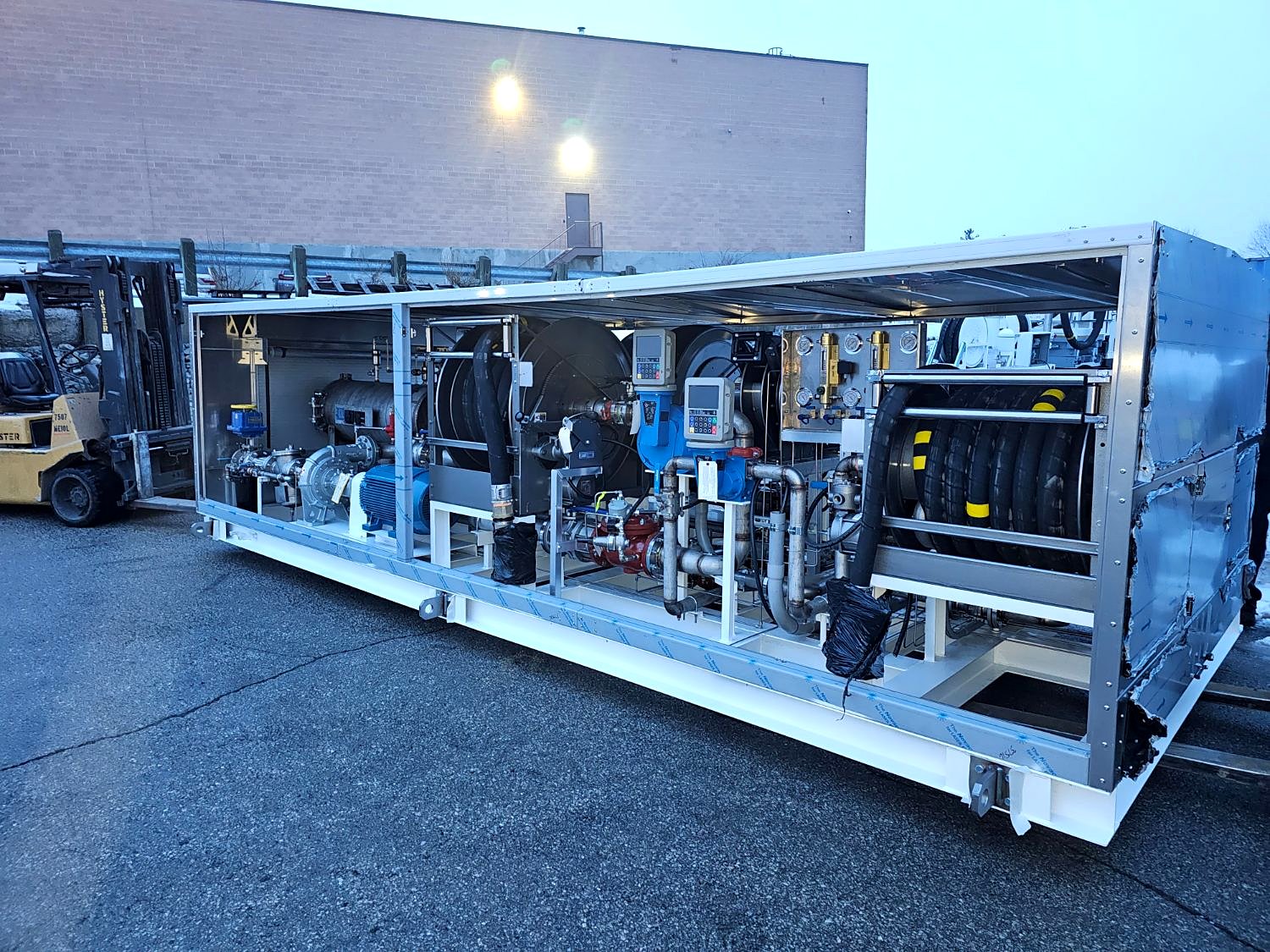 Containerized refueling module with pumps, meters, filtration and hose reels