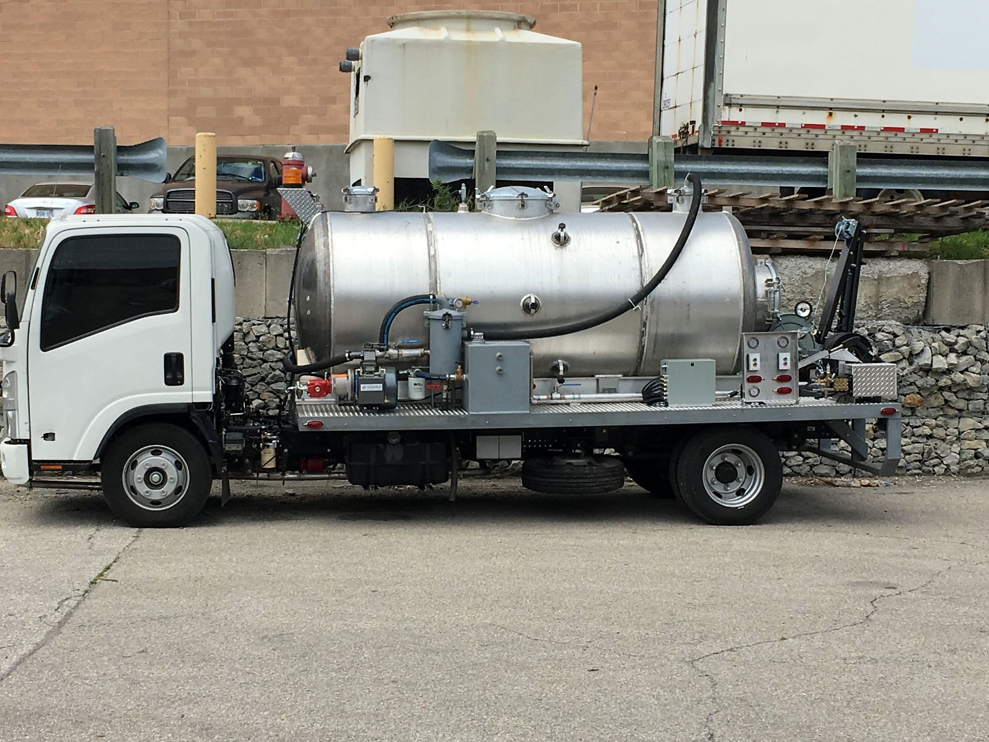Lemico hydrant pit cleaner on an Isuzu chassis with aluminum tank, pumps, controls and rear crane